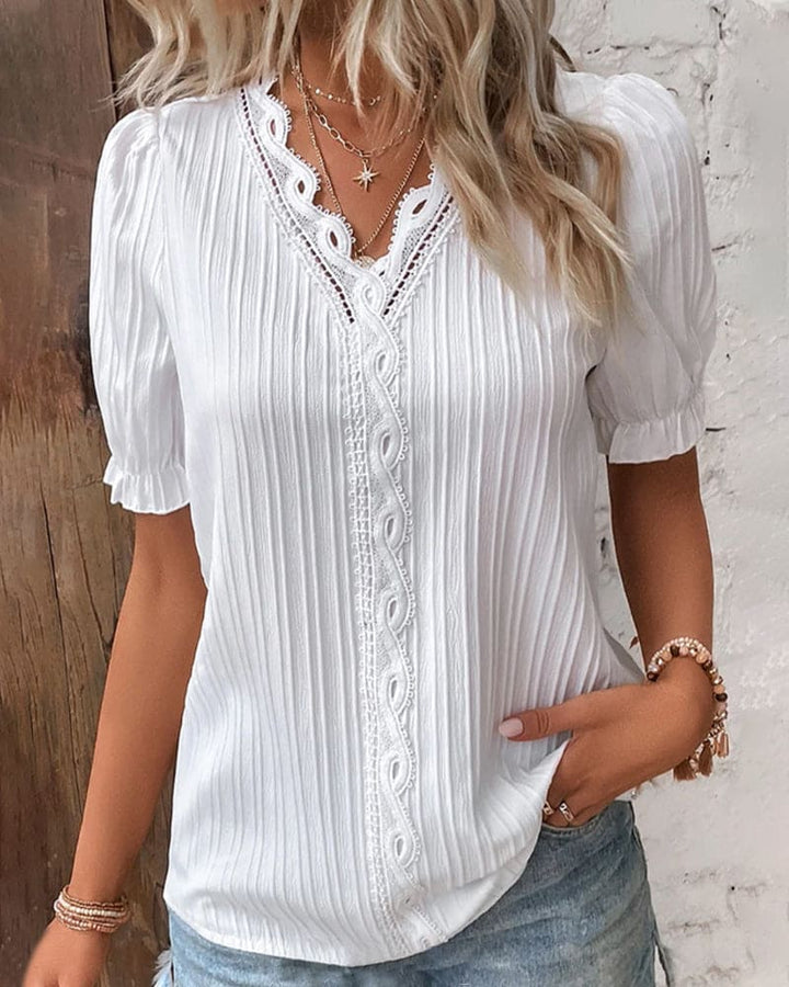 Blusa in pizzo con scollo a V da donna