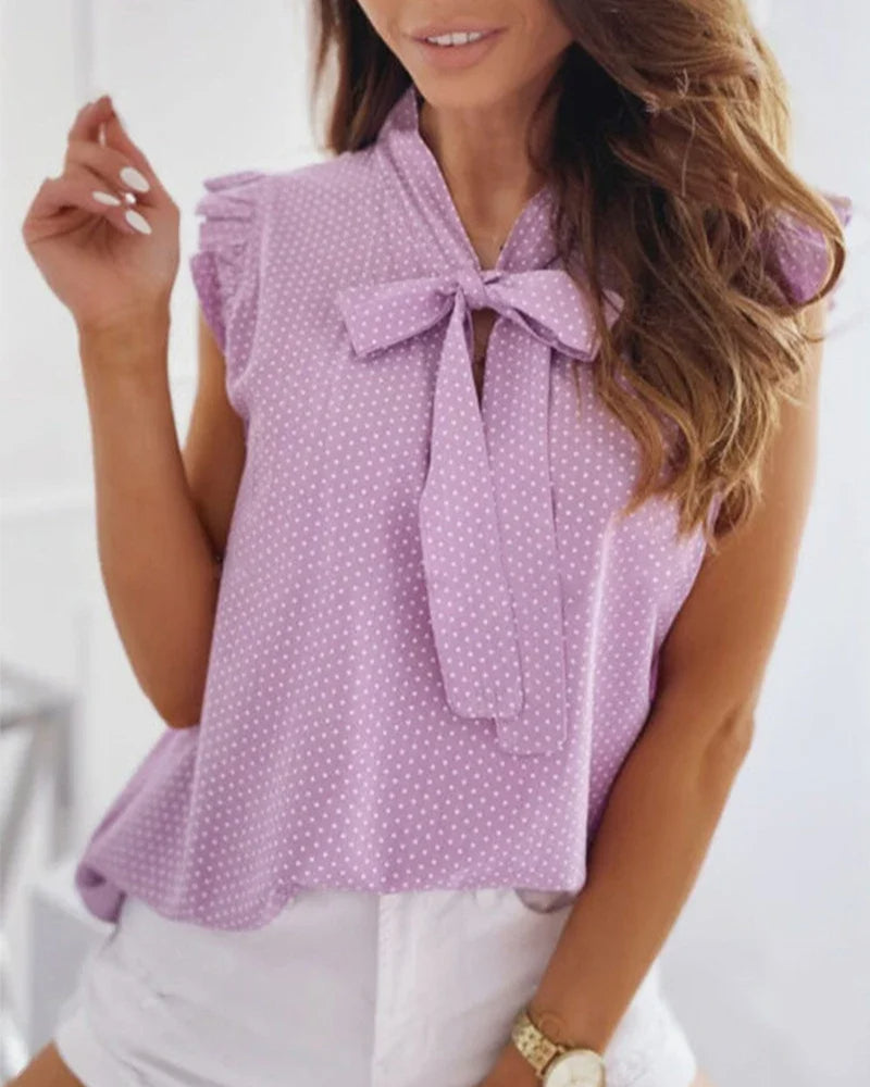 Brianna – Blusa smanicata con volant e fiocco da donna