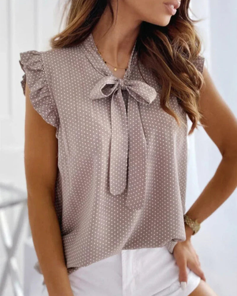 Brianna – Blusa smanicata con volant e fiocco da donna