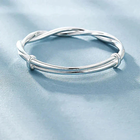 Bracciale rigido intrecciato color argento