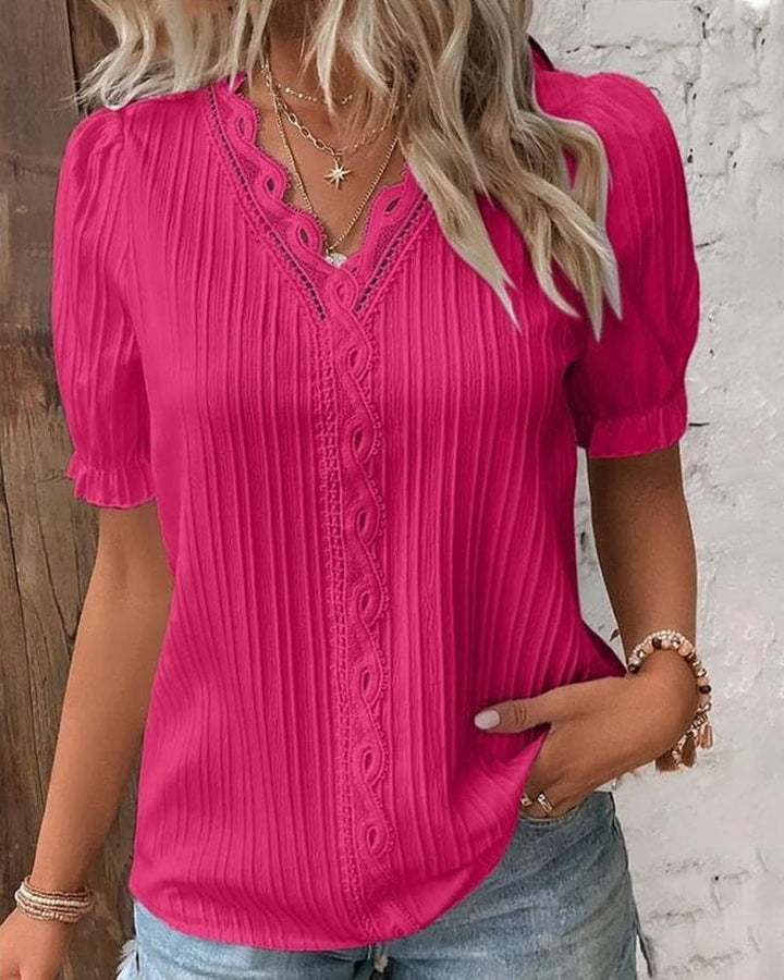 Blusa in pizzo con scollo a V da donna