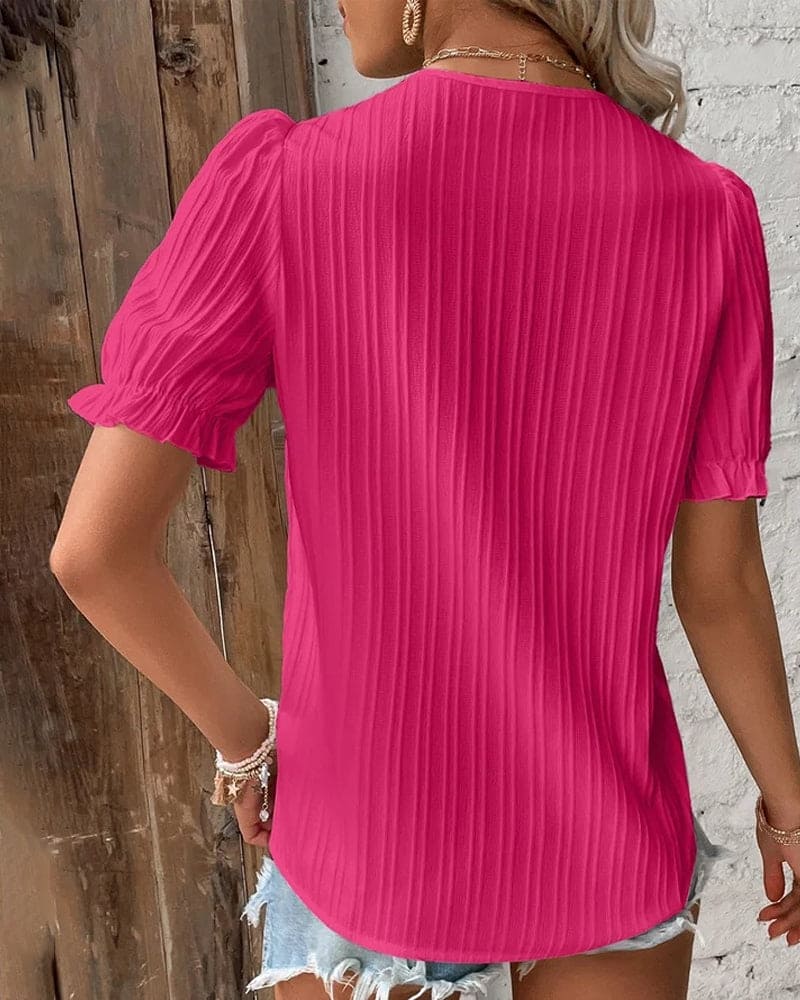 Blusa in pizzo con scollo a V da donna