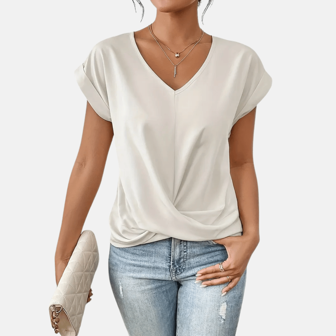 Blusa con scollo a V e orlo drappeggiato da donna