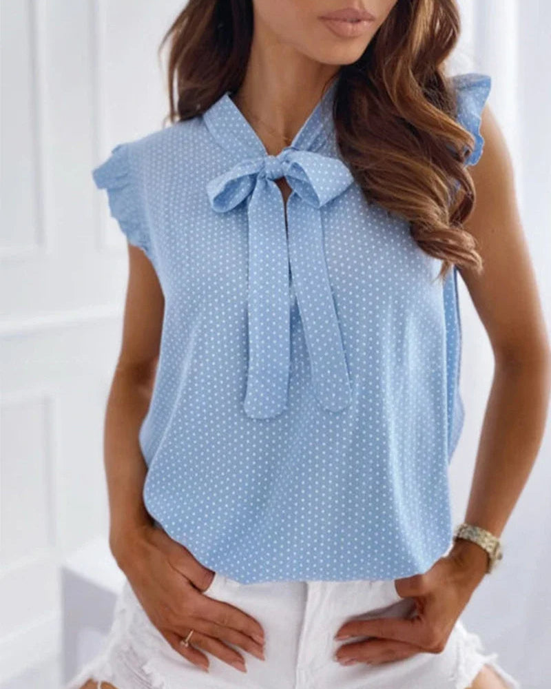 Brianna – Blusa smanicata con volant e fiocco da donna