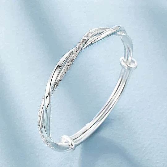 Bracciale rigido intrecciato color argento