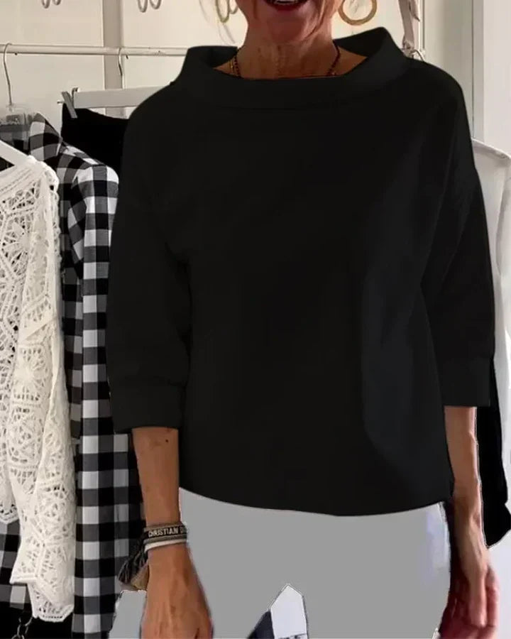 Top casual con risvolti larghi e mezzo collo alto per un look elegante