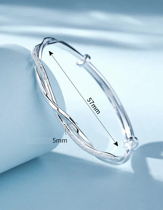 Bracciale rigido intrecciato color argento
