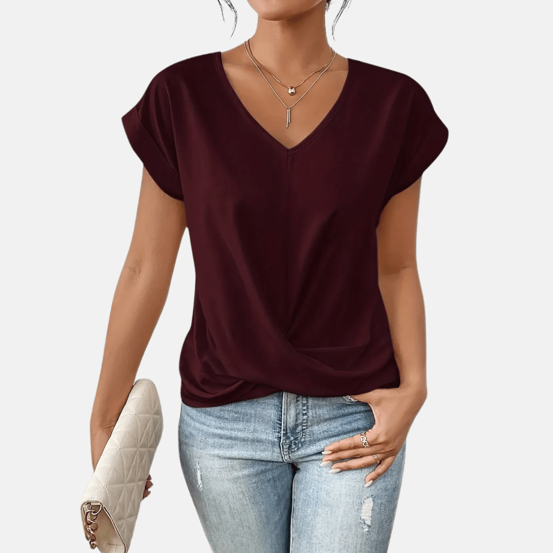 Blusa con scollo a V e orlo drappeggiato da donna