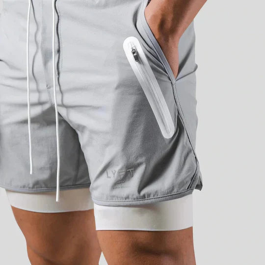 Pantaloni sportivi 2 in 1 con strato a compressione da uomo