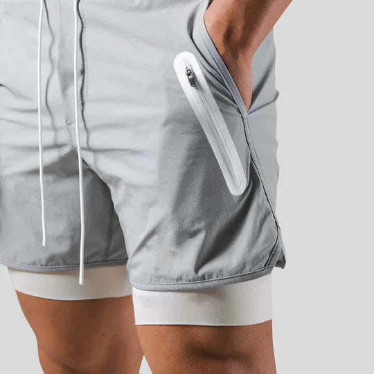 Pantaloni sportivi 2 in 1 con strato a compressione da uomo