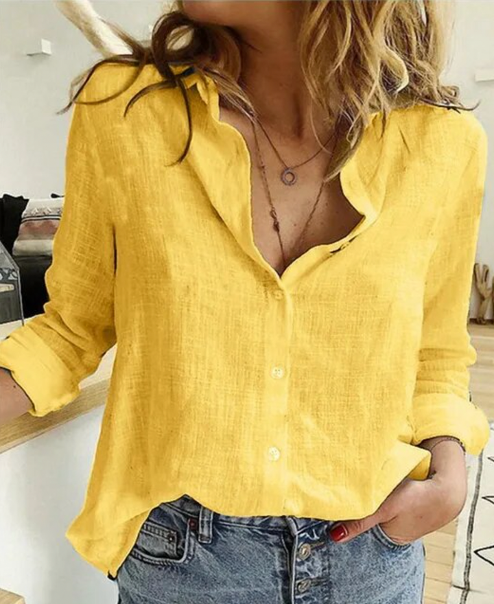 Camicetta a maniche lunghe con drappeggi eleganti e tessuto morbido